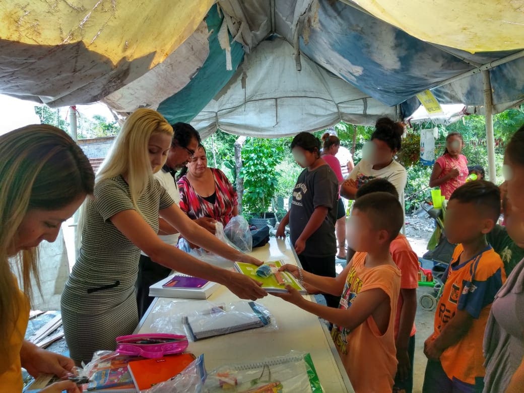 Distribution of new school uniforms and backpacks