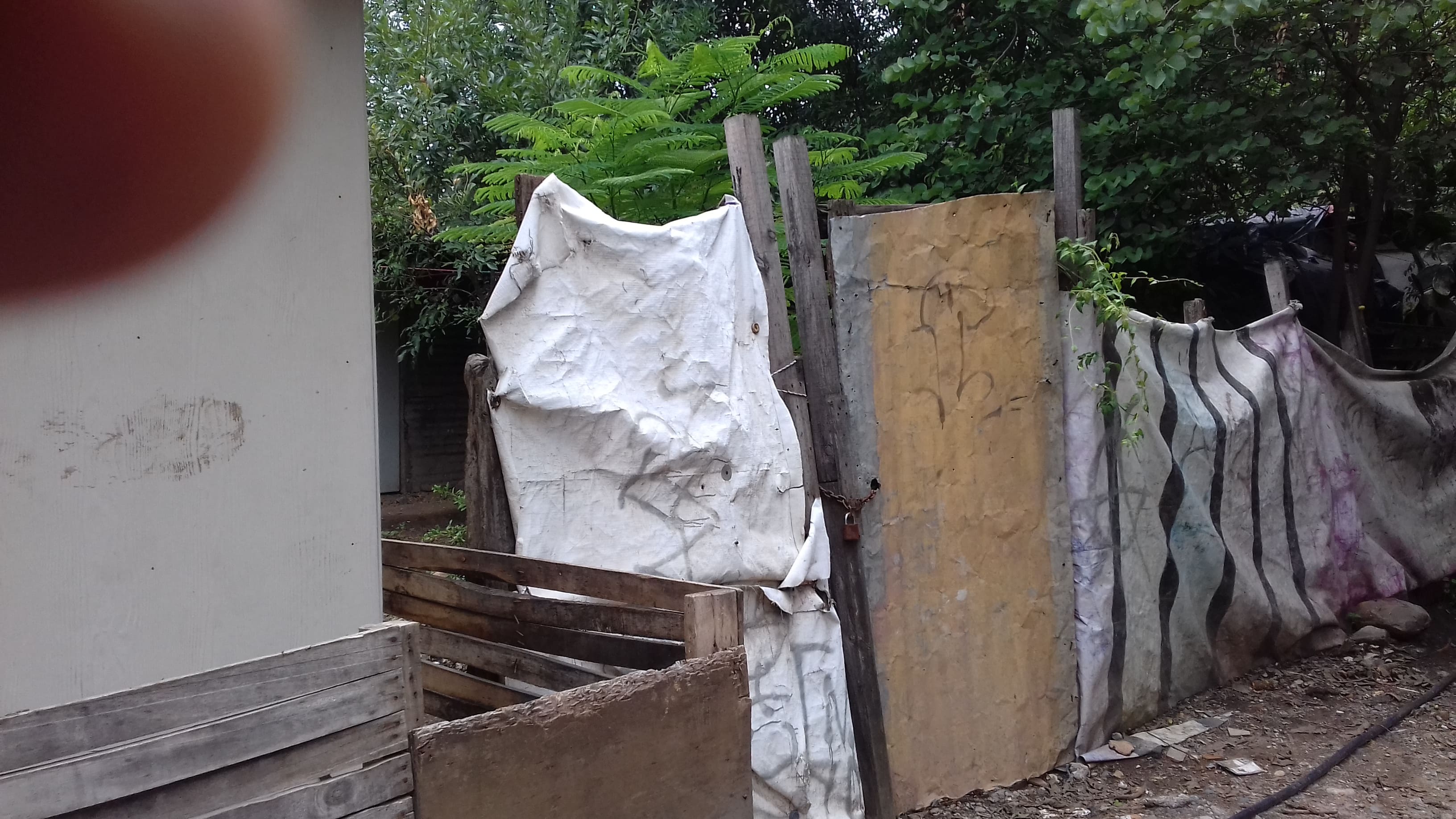 Block construction attempt next to precarious wood structure