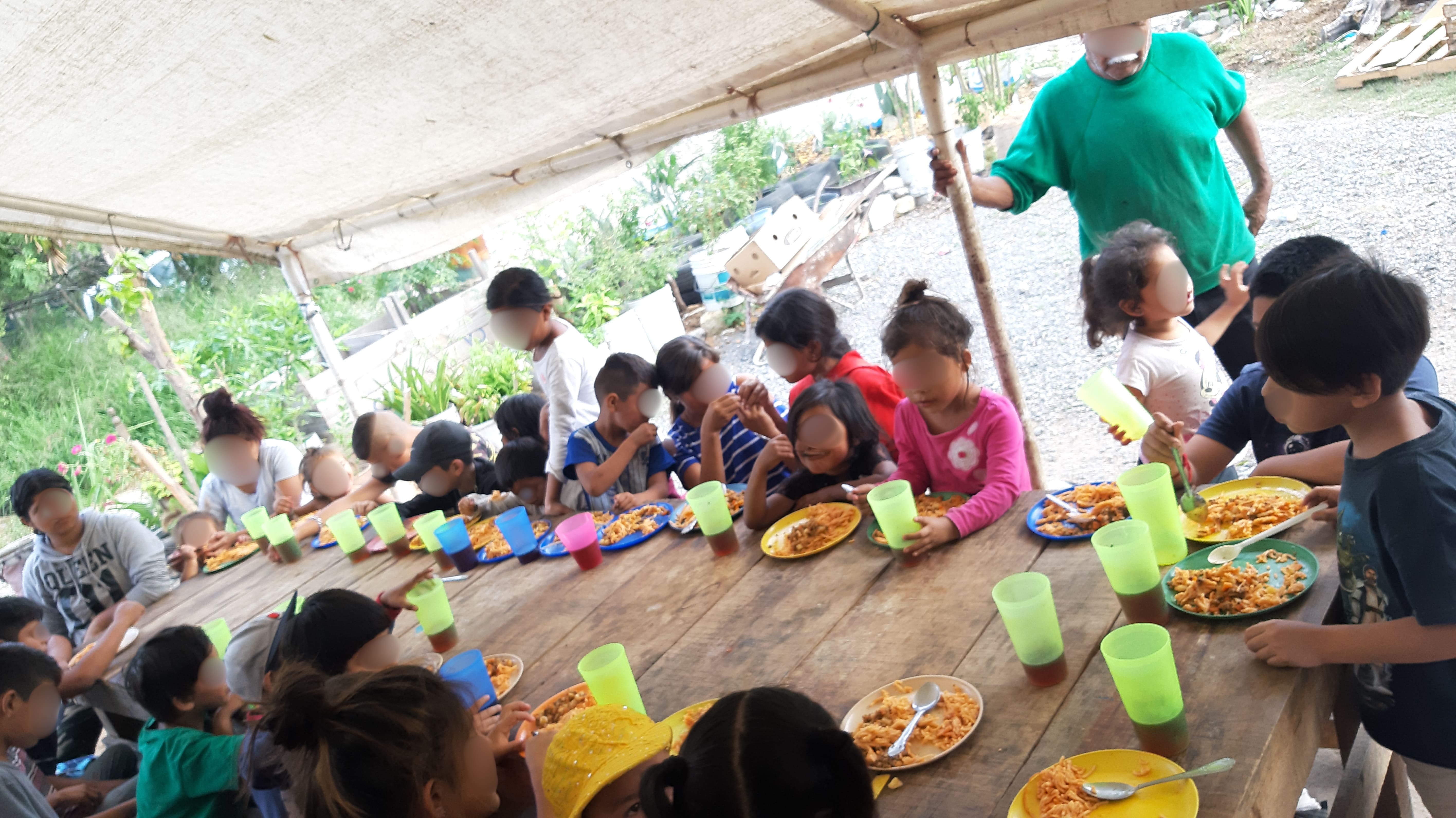 Mothers serving community meals