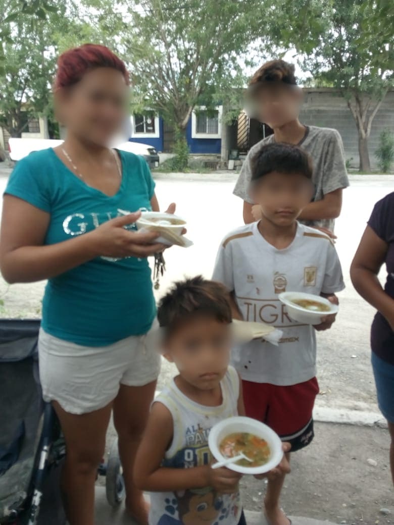 Volunteers serving warm food
